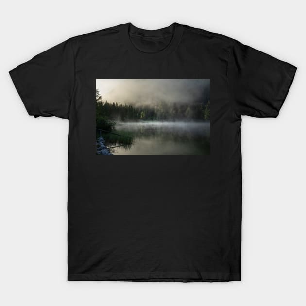 Misty Lake 2. Amazing shot of a wooden house in the Ferchensee lake in Bavaria, Germany, in front of a mountain belonging to the Alps. Scenic foggy morning scenery at sunrise. T-Shirt by EviRadauscher